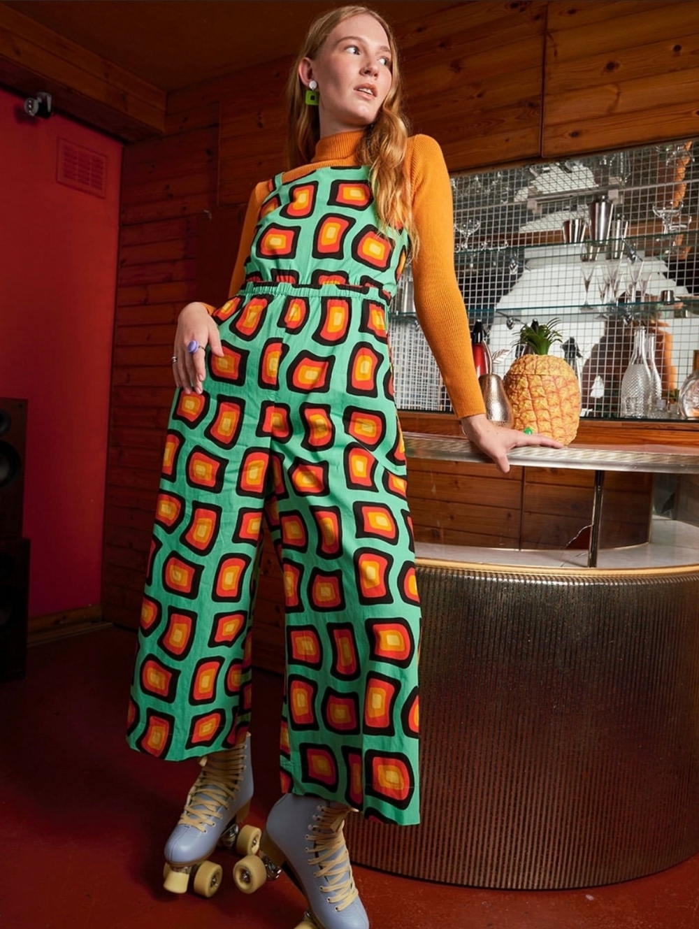Lucy & Yak Teal Jumpsuit with Red, Yellow & Black Geometric Print